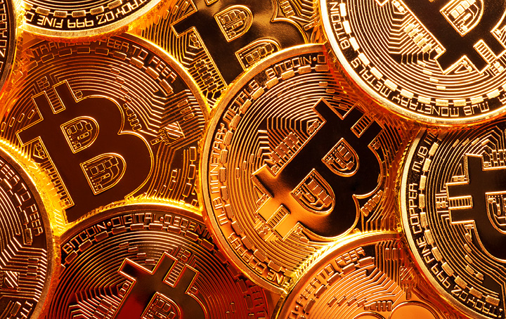 Gold coins with Bitcoin logo