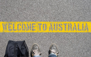 Welcome To Australia on road in yellow paint