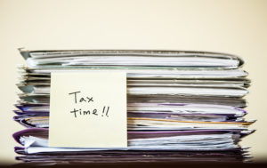 Stack of tax returns at Tax Time
